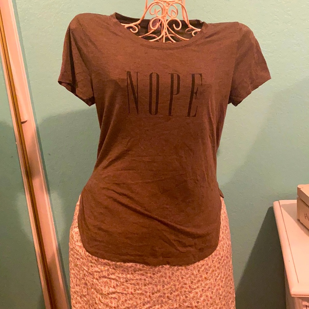 SASSY Designer Tee Shirt. Comfortable and Casual. Size Large and can fit nicely.